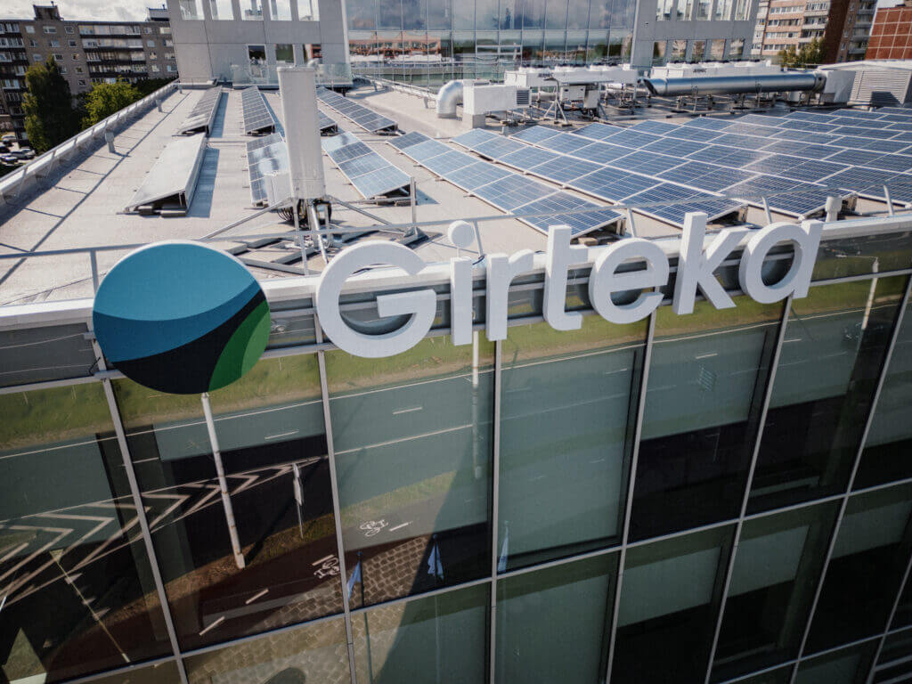 Girteka staff toast office opening at “housewarming” with wine, DJ and giveaways